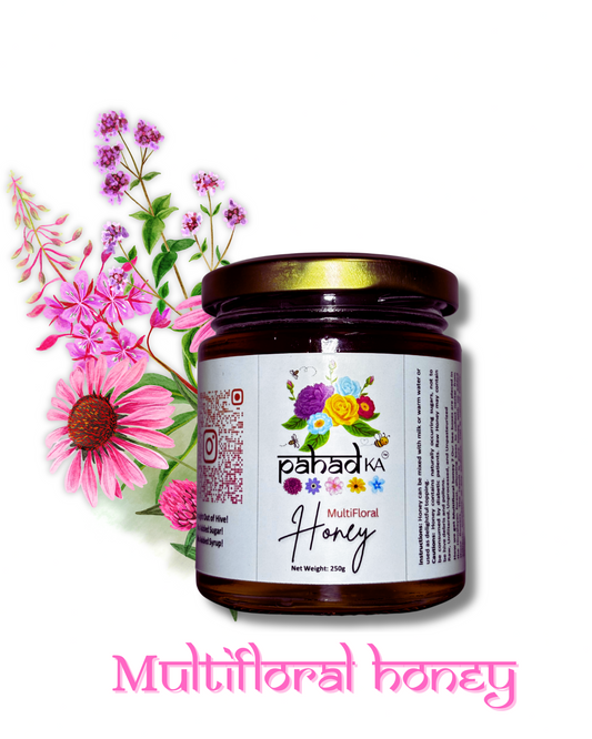 Jar of multifloral honey with flowers on a white background