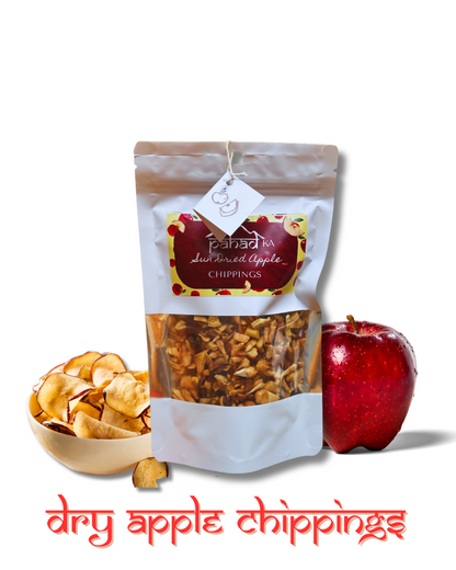 Bag of dry apple chippings with a bowl of chippings and an apple on a white background